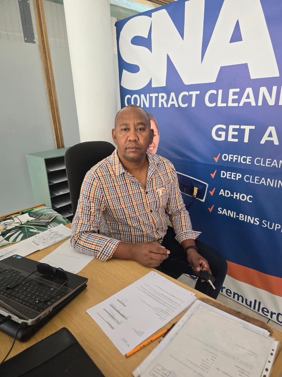Founder Andre Muller at the SNA Cleaning Services office