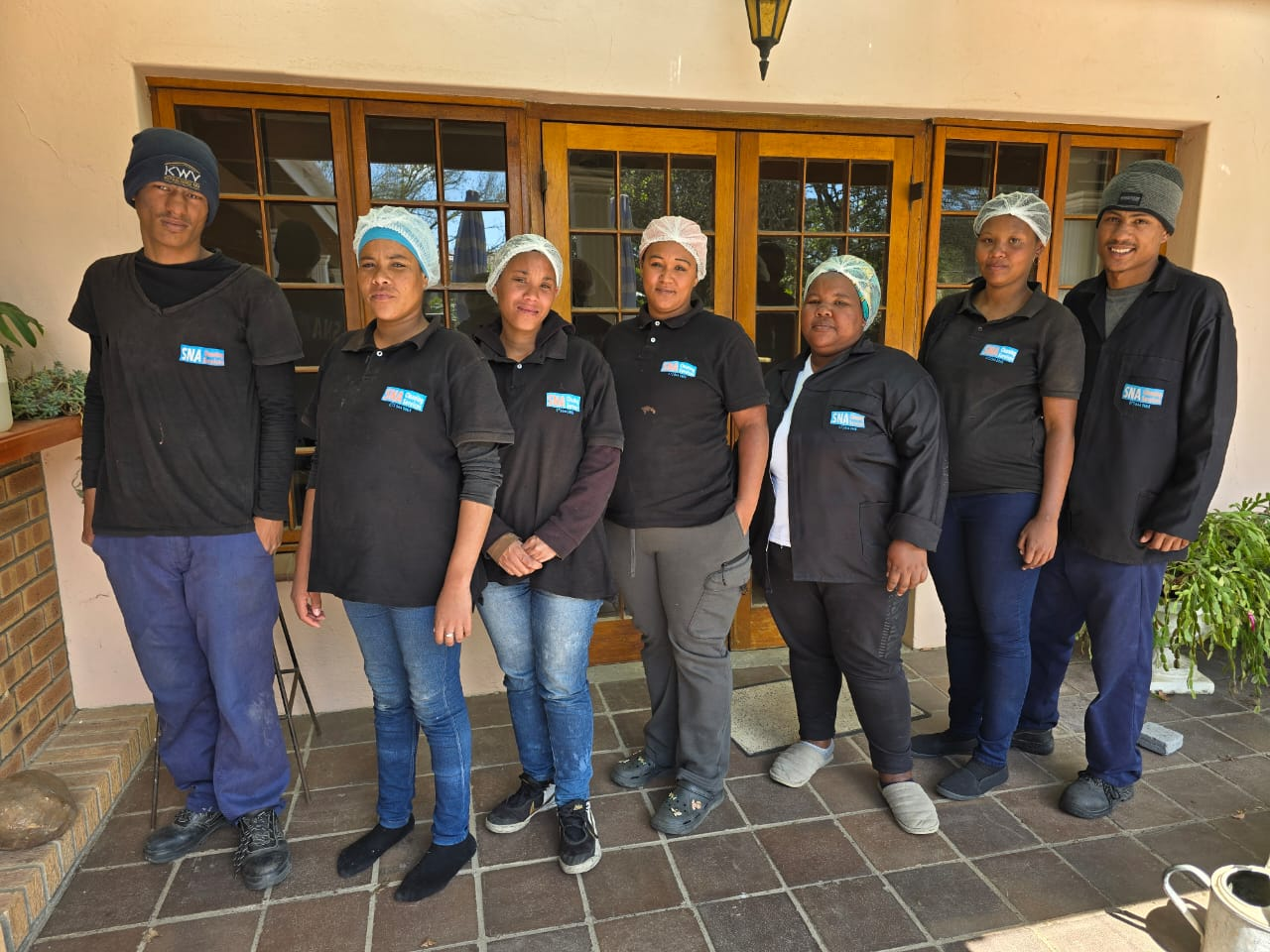 SNA Cleaning Services staff team in uniform